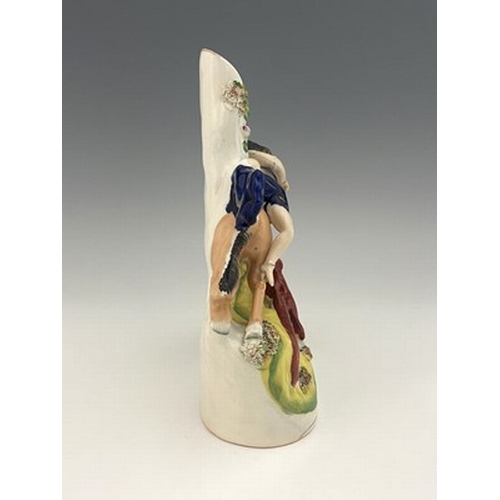 1041 - A Staffordshire spill vase modelled as an equestrian figure of Mazeppa, circa 1860, central draped f... 