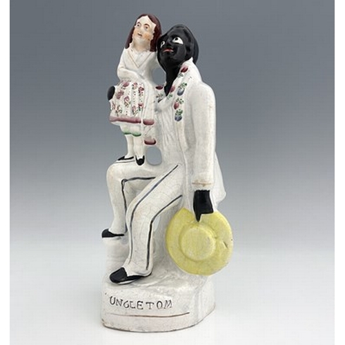 1047 - A Staffordshire figure of 'Uncle Tom' and 'Younge Eva', circa 1850, white enamel with painted polych... 