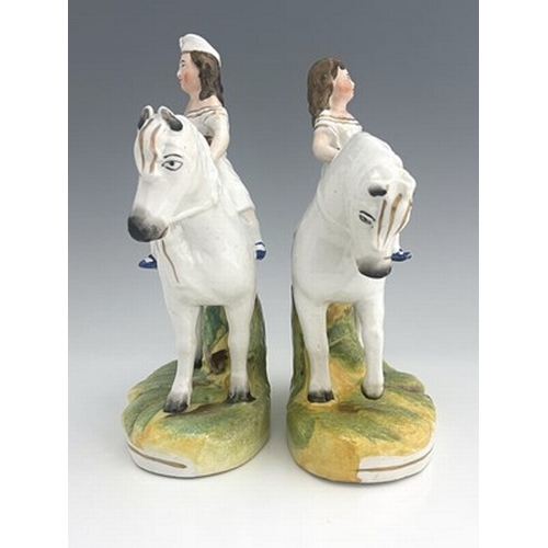 1048 - A Staffordshire figure pair of royal children on horseback, circa 1850, attributed to Thomas Parr, m... 