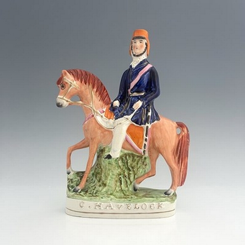 1049 - A Staffordshire portrait figure of Sir Henry Havelock on horseback, painted in polychrome enamels wi... 