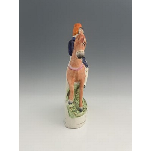 1049 - A Staffordshire portrait figure of Sir Henry Havelock on horseback, painted in polychrome enamels wi... 