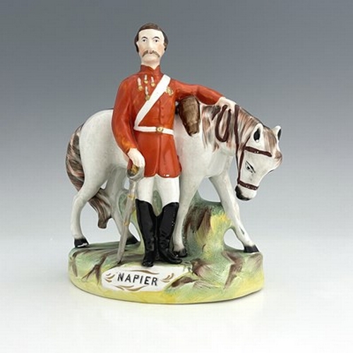 1053 - A Staffordshire figure of Garibaldi, by Thomas Parr, circa 1865, modelled standing beside his horse,... 