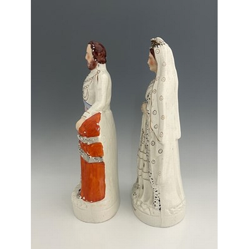 1055 - A pair of large Staffordshire portrait figures of 'The Queen' and 'The Prince of Wales', circa 1870,... 