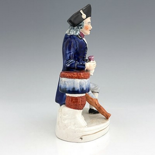 1060 - A Staffordshire figure of a Greenwich Hospital pensioner, circa 1850, modelled as a seated sailor wi... 