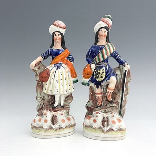 1066 - A pair of Staffordshire shepherd and shepherdess figures in Scottish Highland dress, circa 1850, Sco... 