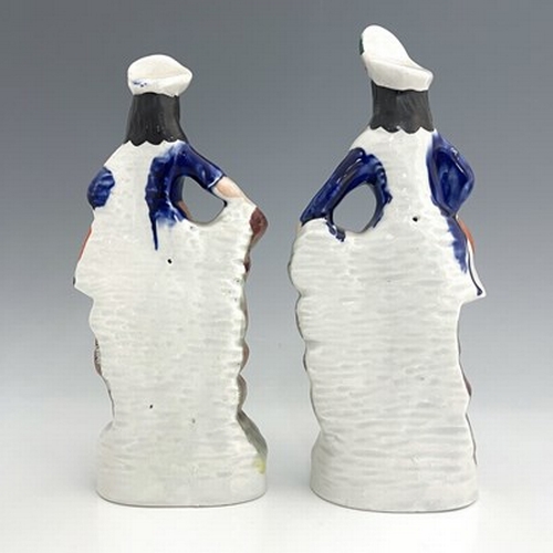 1066 - A pair of Staffordshire shepherd and shepherdess figures in Scottish Highland dress, circa 1850, Sco... 