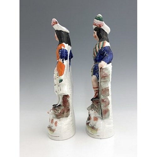 1066 - A pair of Staffordshire shepherd and shepherdess figures in Scottish Highland dress, circa 1850, Sco... 