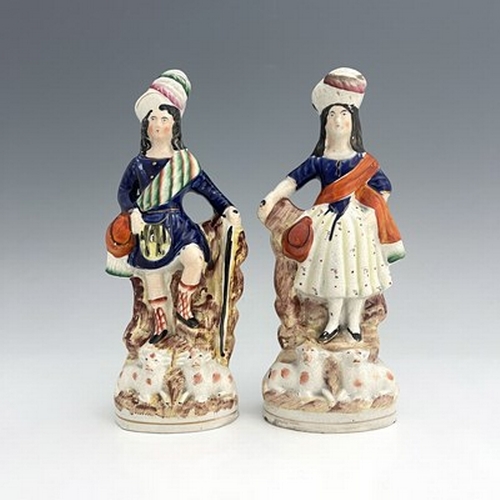 1067 - A pair of Staffordshire shepherd and shepherdess figures in Scottish Highland dress, circa 1850, Sco... 