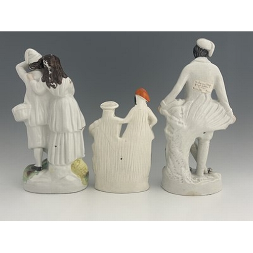 1071 - Three Staffordshire figure groups , circa 1865, one modelled as a standing male fruitseller in white... 