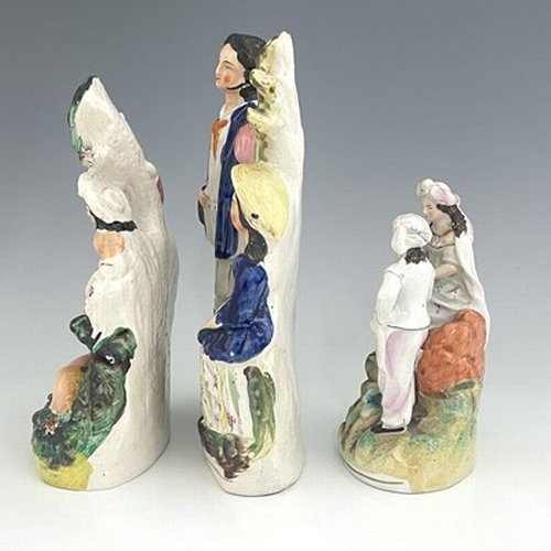 1072 - Three Staffordshire spill vases, circa 1830, including two children and a faun in a forest setting, ... 