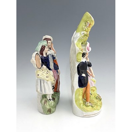 1079 - A Staffordshire figure group of musicians/lovers, circa 1850, arboreal scene modelled as a pair of l... 