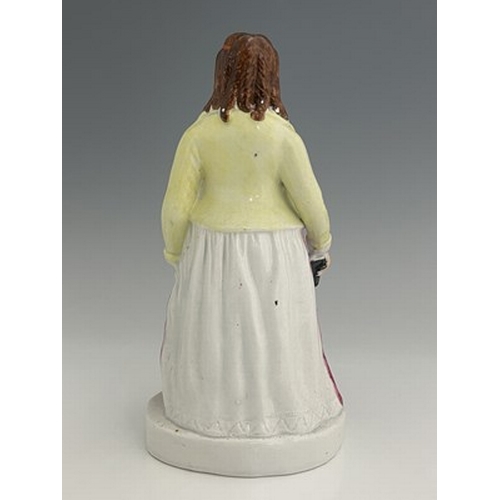 1081 - A Staffordshire figure of 'Eliza Cook', circa 1850, modelled standing female figure holding a book o... 