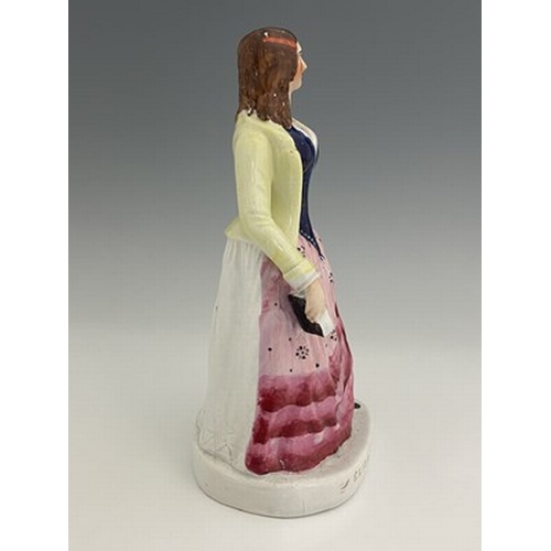 1081 - A Staffordshire figure of 'Eliza Cook', circa 1850, modelled standing female figure holding a book o... 