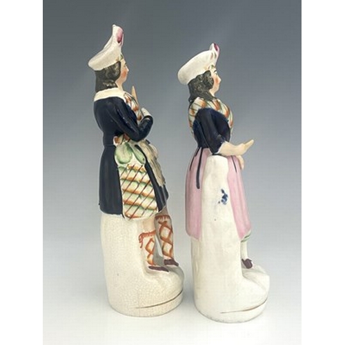 1084 - Staffordshire figure pair of Scottish musicians and dancers, circa 1850, modelled as a standing male... 