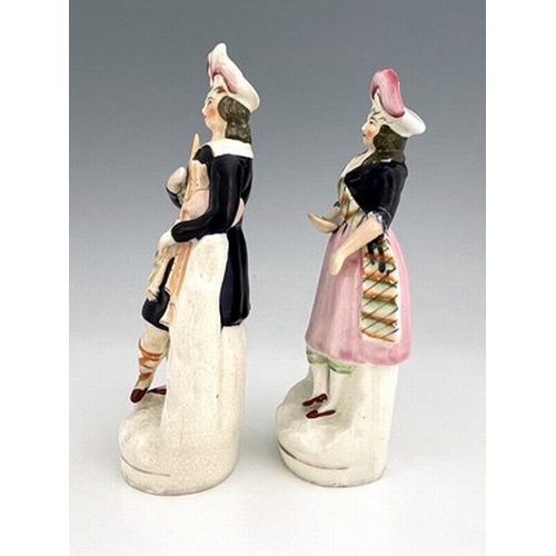 1084 - Staffordshire figure pair of Scottish musicians and dancers, circa 1850, modelled as a standing male... 