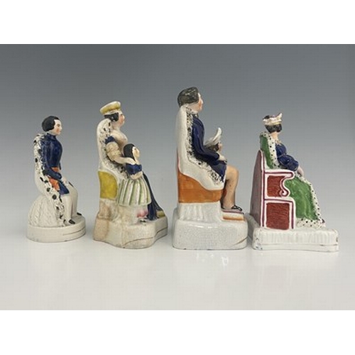 1085 - Four Staffordshire royal figure groups, circa 1840, including Queen Victoria, possibly at her corona... 