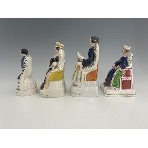 1085 - Four Staffordshire royal figure groups, circa 1840, including Queen Victoria, possibly at her corona... 