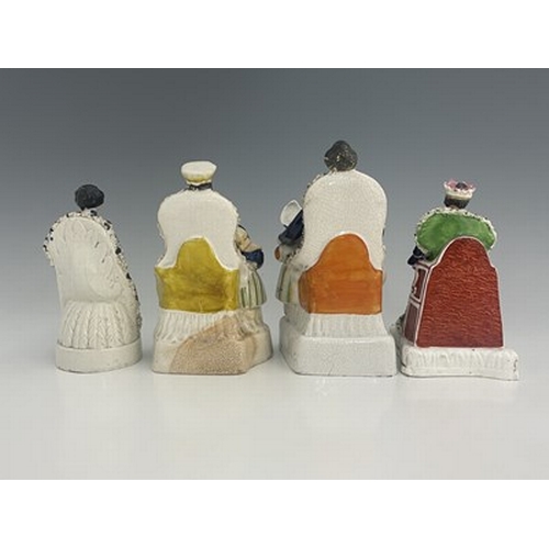 1085 - Four Staffordshire royal figure groups, circa 1840, including Queen Victoria, possibly at her corona... 