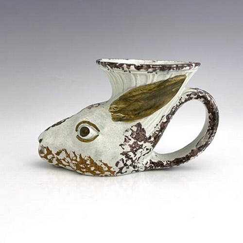 1088 - A Staffordshire Prattware rhyton, circa 1800, modelled as a rabbits head, sponge decorated, 9cm high