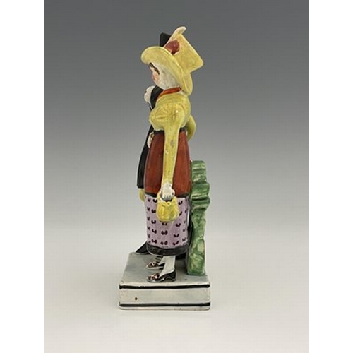 1092 - A Staffordshire pearlware figure group of the Dandies, early 19th century, on square platform base, ... 