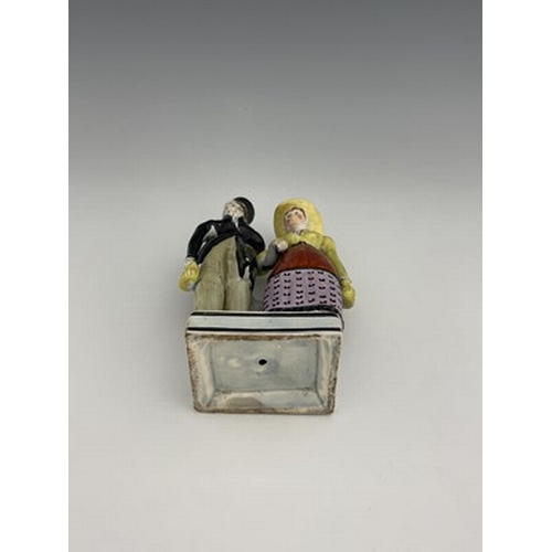 1092 - A Staffordshire pearlware figure group of the Dandies, early 19th century, on square platform base, ... 