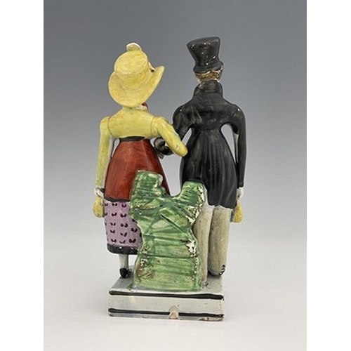 1092 - A Staffordshire pearlware figure group of the Dandies, early 19th century, on square platform base, ... 