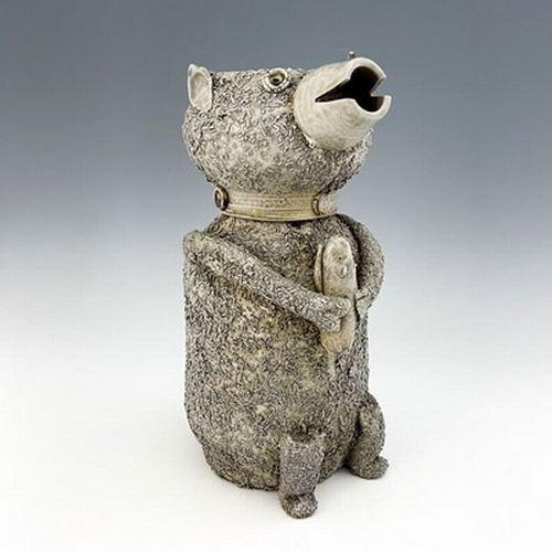 1093 - A Staffordshire off white salt glazed stoneware bear jar and cover, modelled as a sitting bear holdi... 