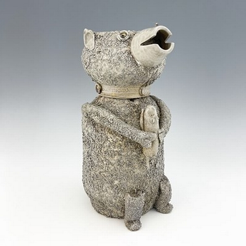 1093 - A Staffordshire off white salt glazed stoneware bear jar and cover, modelled as a sitting bear holdi... 