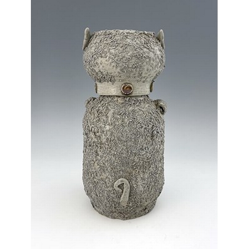 1093 - A Staffordshire off white salt glazed stoneware bear jar and cover, modelled as a sitting bear holdi... 