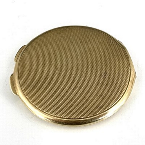 110 - An Art Deco 9 carat gold compact, Goldsmiths and Silversmiths Company, London 1937, circular, engine... 