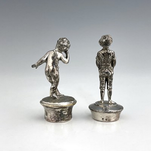 127 - WMF, two silver plated figural bottle stoppers, one modelled as a boy in lederhosen, the other as a ... 