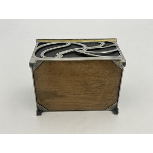 129 - WMF, a Jugendstil silver plated and ebonised cedar wood cigar box, cuboid form with hinged lid, open... 