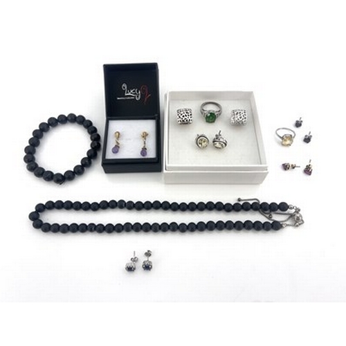 13 - A collection of gem set jewellery, including a citrine ring and earring set, sapphire and ruby earri... 