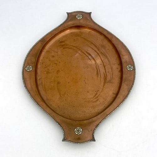 147 - A E Jones, an Arts and Crafts copper and silver tray, circa 1920, planished twin handled oval form w... 