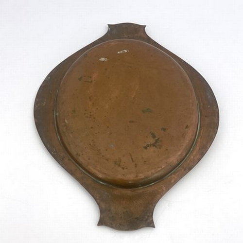 147 - A E Jones, an Arts and Crafts copper and silver tray, circa 1920, planished twin handled oval form w... 