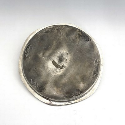 151 - Archibald Knox for Liberty and Co., a Tudric Arts and Crafts pewter tray, model 0716, planished circ... 