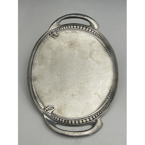 154 - Archibald Knox for Liberty & Co, a Tudric pewter tray, circa 1905, oval form with integral handles a... 