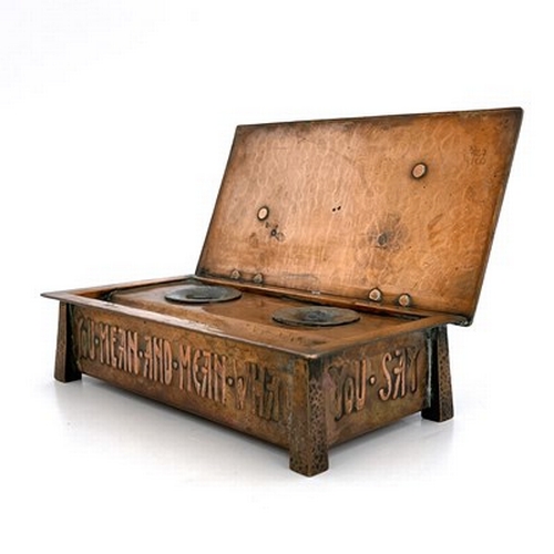 155 - An Arts and Crafts copper lidded ink casket, planished cuboid form with tapered obelisk legs, the si... 