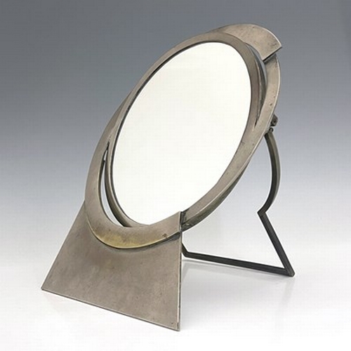 166 - Maison Desny, a French Art Deco nickel plated swing easel mirror, circa 1930, the circular glass hin... 