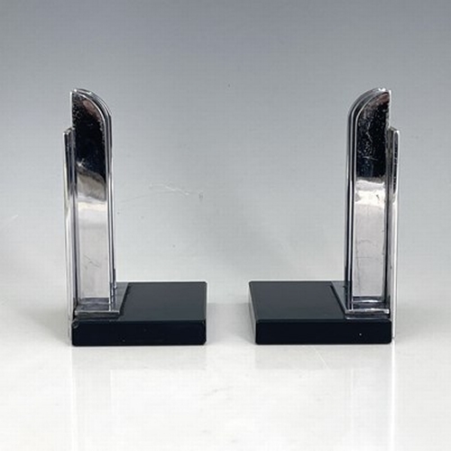 168 - A pair of Art Deco chrome and black glass bookends, circa 1930, the rectangular slabs fin grill upri... 