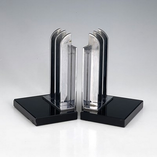 168 - A pair of Art Deco chrome and black glass bookends, circa 1930, the rectangular slabs fin grill upri... 