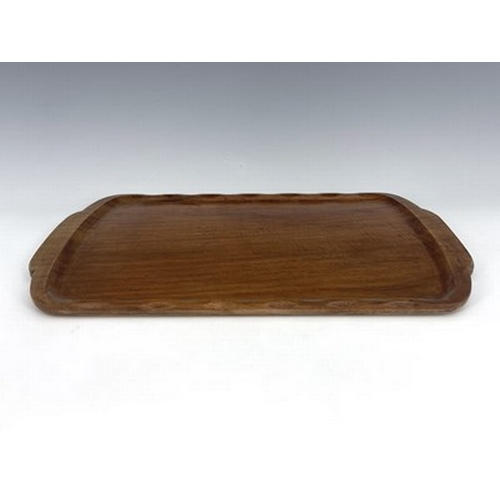 176 - Stanley Webb Davies, an Arts and Crafts carved walnut tray, 1941, rectangular form with serpentine r... 