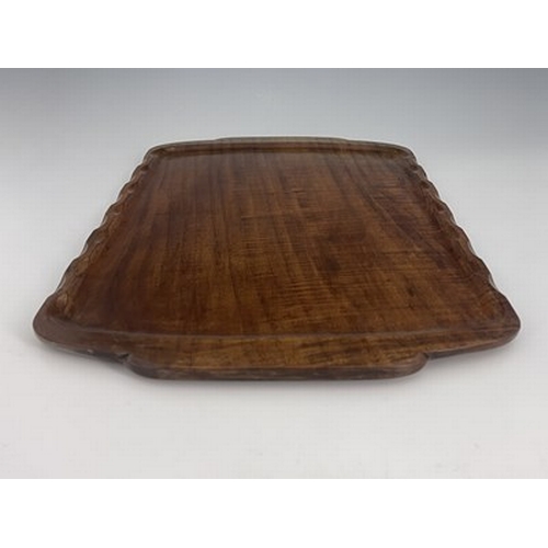 176 - Stanley Webb Davies, an Arts and Crafts carved walnut tray, 1941, rectangular form with serpentine r... 