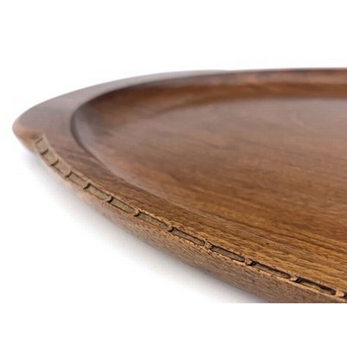 177 - Stanley Webb Davies, an Arts and Crafts carved walnut tray, 1945, twin handled oval form, with chain... 