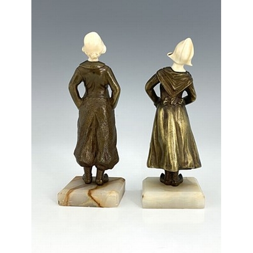 187 - Louis Sosson (attributed), a pair of Art Deco bronze and ivory figures, circa 1925, modelled as a Du... 