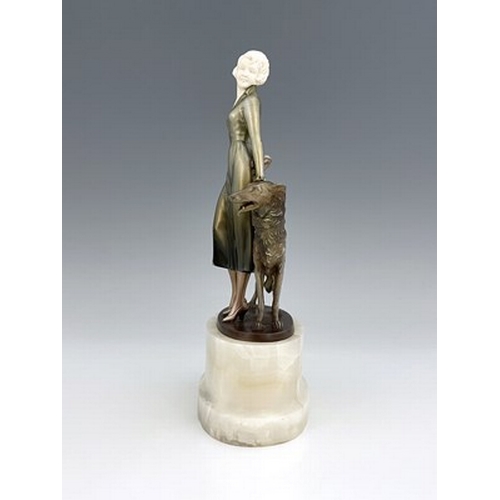 192 - Josef Lorenzl, an Art Deo cold painted bronze and carved ivory figure group, circa 1925, modelled as... 