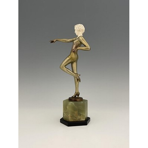 195 - Josef Lorenzl, an Art Deco patinated bronze and ivory figure, circa 1925, modelled as a dancer in le... 