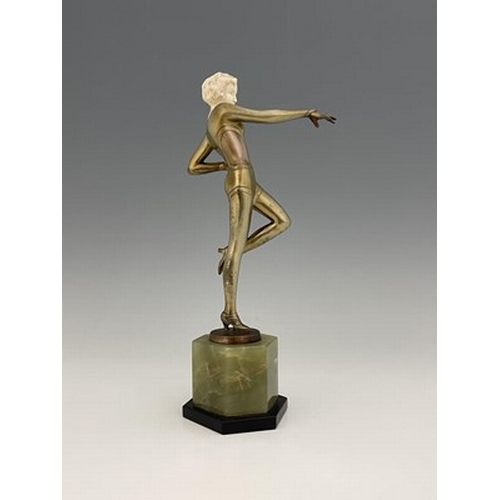 195 - Josef Lorenzl, an Art Deco patinated bronze and ivory figure, circa 1925, modelled as a dancer in le... 