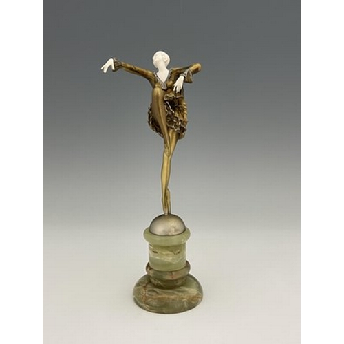 196 - Josef Lorenzl, an Art Deco gilt bronze and carved ivory figure, circa 1925, modelled as a dancer, in... 