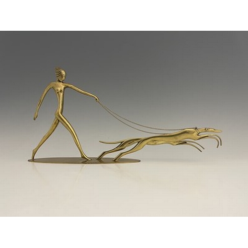 197 - Karl Hagenauer, an Austrian Art Deco brass figure group of Diana with hounds, circa 1930, modelled a... 